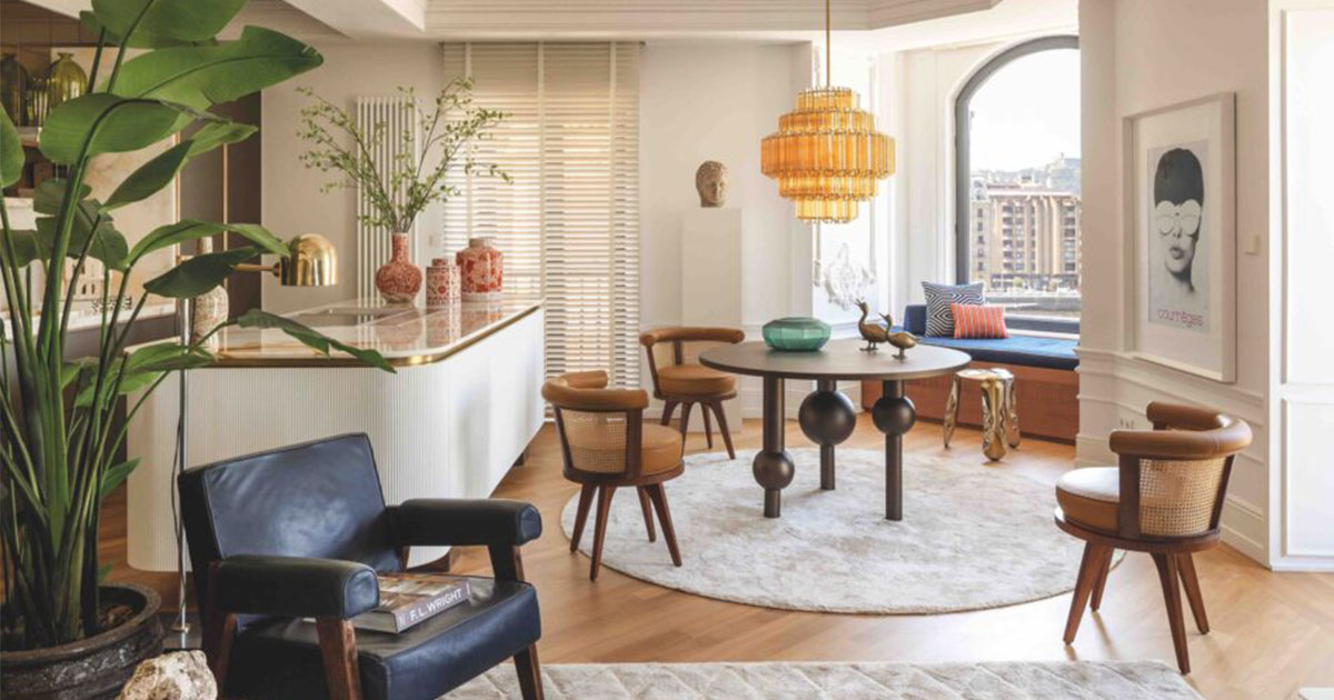 George Dining Chair with walnut wood, rattan, and leather in dining room, part of the San Sebastián residential project designed by Iñigo Iriarte.