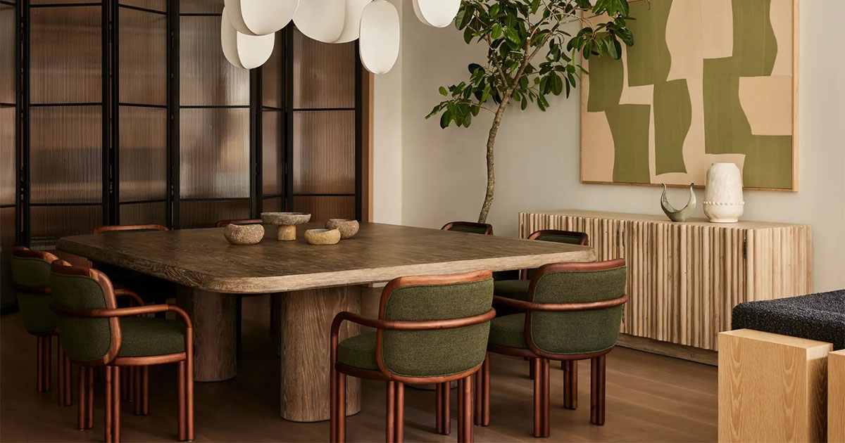 Soho Loft dining room featuring james dining chair in walnut wood with cozy accents by Studio Michael Ellison