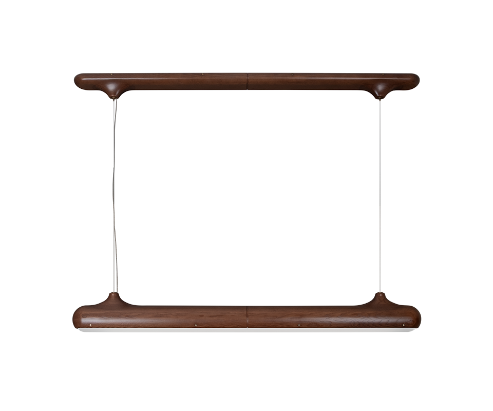 Bruce Suspension Lamp Front view of the Bruce suspension lamp by Wood Tailors Club in smoked walnut wood. A horizontal wooden canopy bar is suspended parallel above a linear luminaire with a white diffuser on its underside, connected by two thin cables at the tapered end fittings.