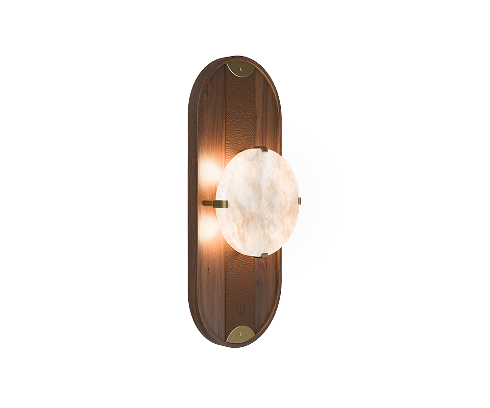 Cavendish Wall Lamp Cavendish Wall Lamp, 45º front view, with the light turned on. Crafted from smoked walnut wood and alabaster, framed in a gentle oval silhouette with aged brushed brass accents, showcasing the lamp’s refined materials and elegant design.