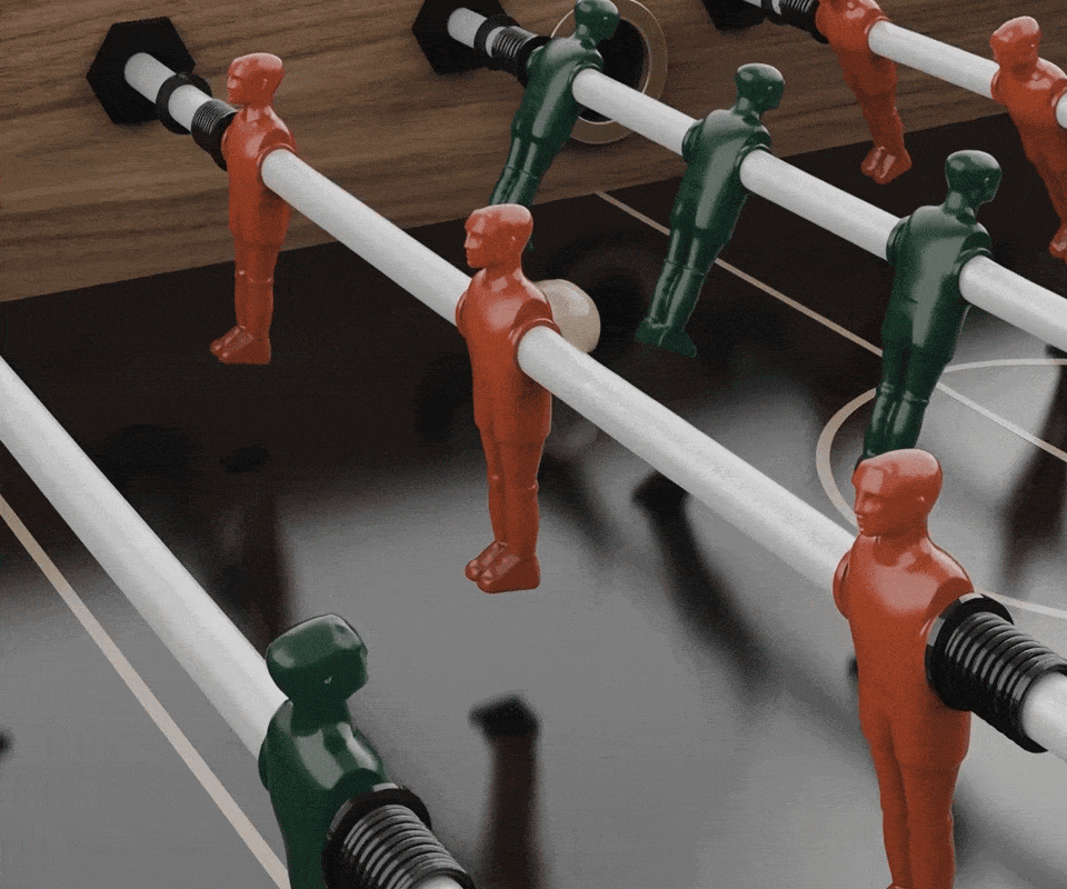 Chesterfield Foosball Table Close-up view of the red and green steel foosball players on the Chesterfield luxury game table.