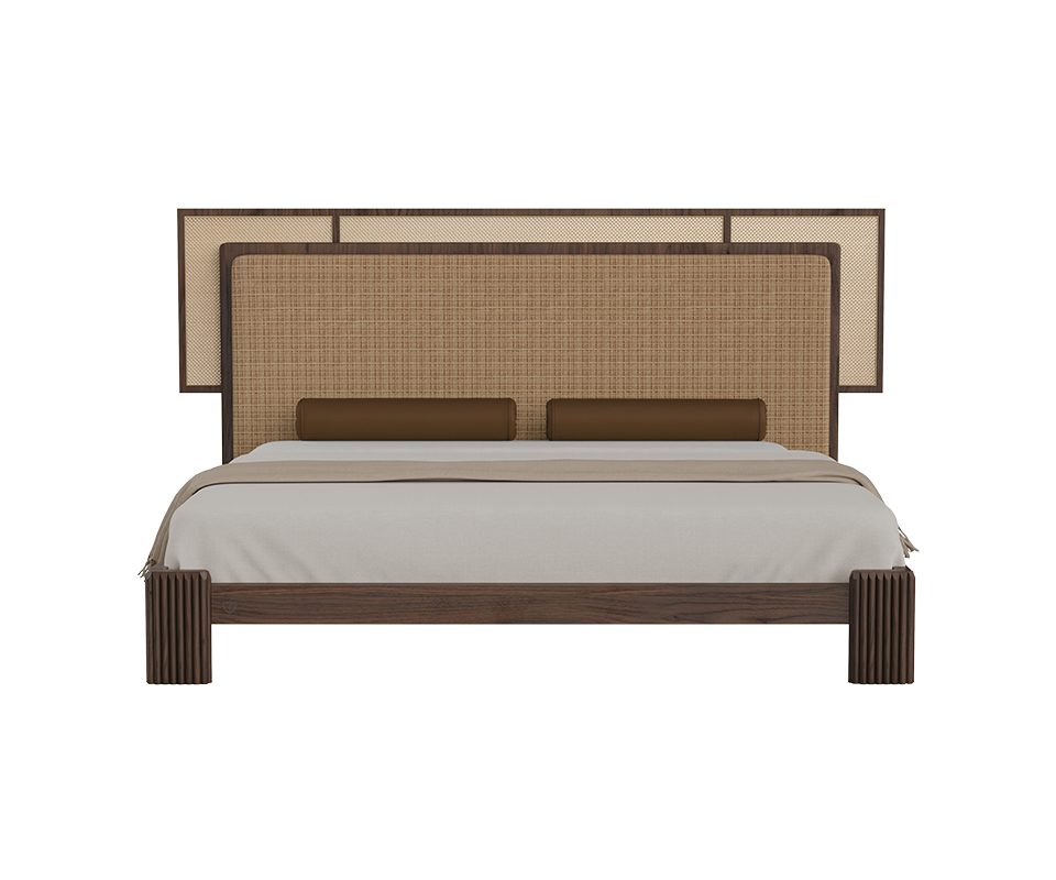 Forbes bed front view featuring a fabric and rattan headboard, cylindrical leather bolster pillows, and a walnut wood frame.