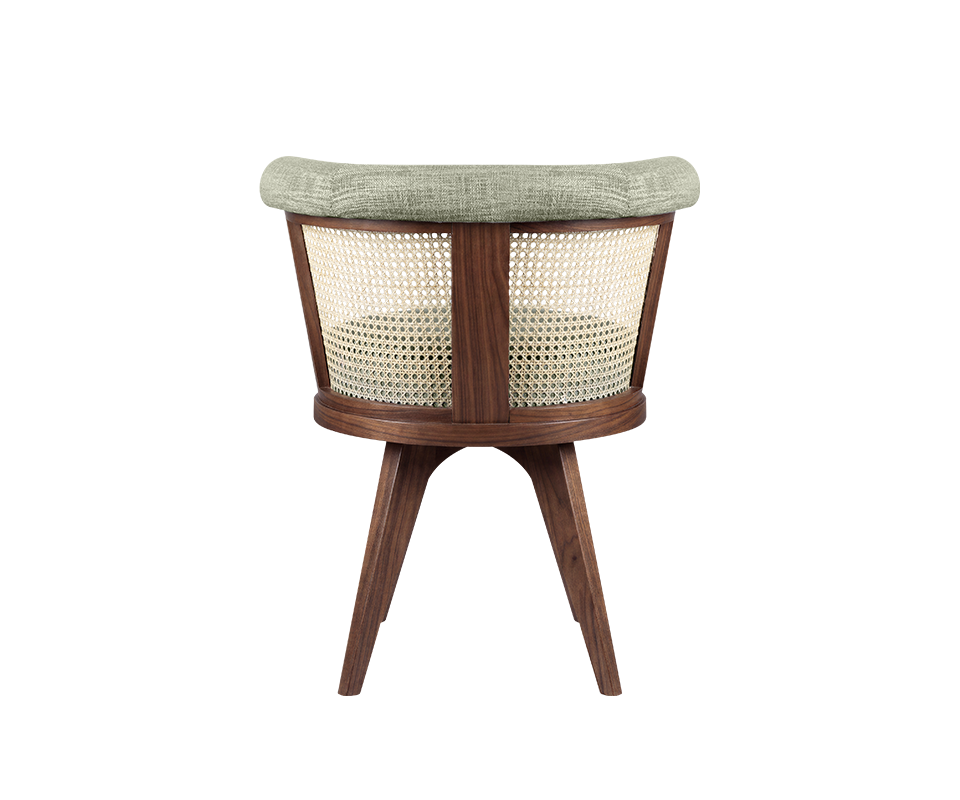 A rear view of the George Dining Chair by Wood Tailors Club, highlighting the elegant smoked walnut wood frame, intricately woven cane rattan backrest, and green fabric-upholstered top.
