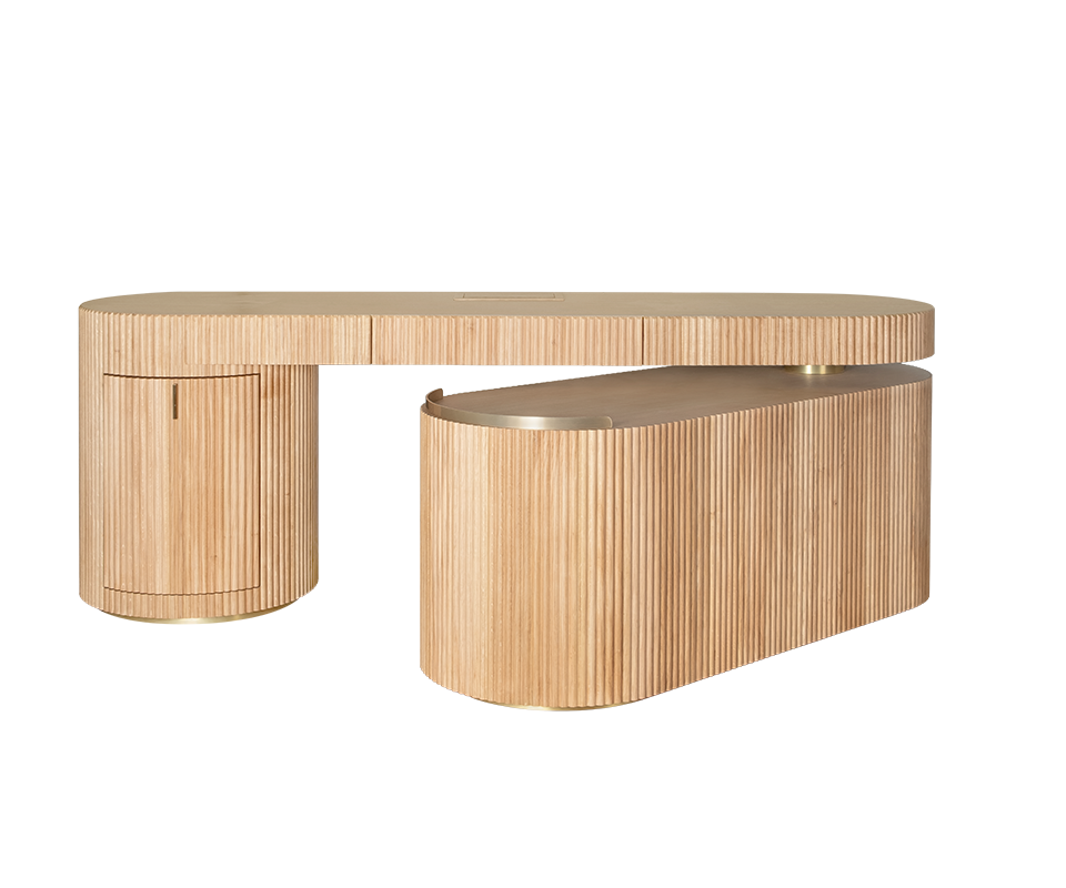 Gifford desk by Wood Tailors Club in oak. Angle view showing the desk's modularity, with the lower oak shelf module in a partially extended position, transitioning from closed to open. Brass detailing is visible on the bases and shelf trim.