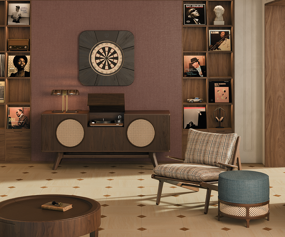 A serene living room bathed in soft daylight from the window, featuring the closed Rochford dartboard by Wood Tailors Club in black-stained ash wood with powder coated stainless steel details. The Harrison sideboard is open, revealing a compartment for storing the turntable, accompanied by a gently glowing Turing table lamp above, a Moore armchair in textured fabric, and the George stool, creating a harmonious and refined interior