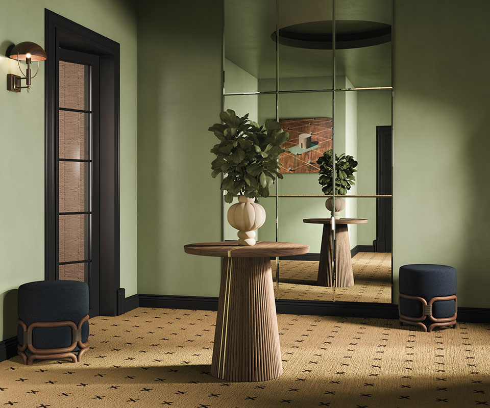 The Power of a Wooden Statement Piece henry ambiente 4 Interior design scene featuring a wall mirror, a Henry II dining table as a wooden statement piece with a decorative vase, two Stefan stools, and a Faraday wall lamp, styled in natural tones.
