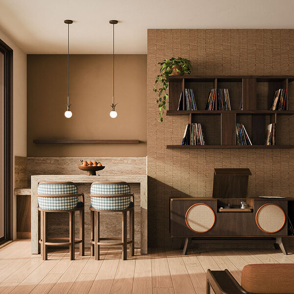 The James bar chair has a timeless design, upholstered in a blue and white checker-pattern fabric, is placed in a living room setting next to the Harrison sideboard, crafted in walnut and showcasing a vinyl record player inside. The space is complemented by two illuminated Berlin pendant lamps.