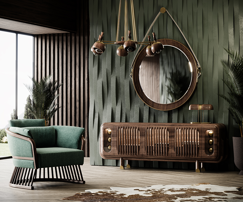 A luxurious interior featuring the Kennedy Sideboard in dark walnut against a textured dark green 3D wall. Above the sideboard hangs the circular Reynolds Mirror with its signature leather strap, illuminated by the Essen Suspension Lamp featuring a wooden and brass structure. To the left sits the Johnson Armchair in teal upholstery with a distinctive slatted wooden base. The scene is completed with herringbone wood flooring, a cowhide rug, and lush indoor plants, creating a cohesive mid-century modern aesthetic.