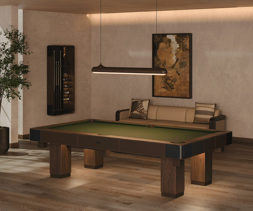 Morley Limited-Edition Pool Table in a living room setting, illuminated by Bruce Suspension lighting, with the Kimberley Sofa and warm mood lighting.