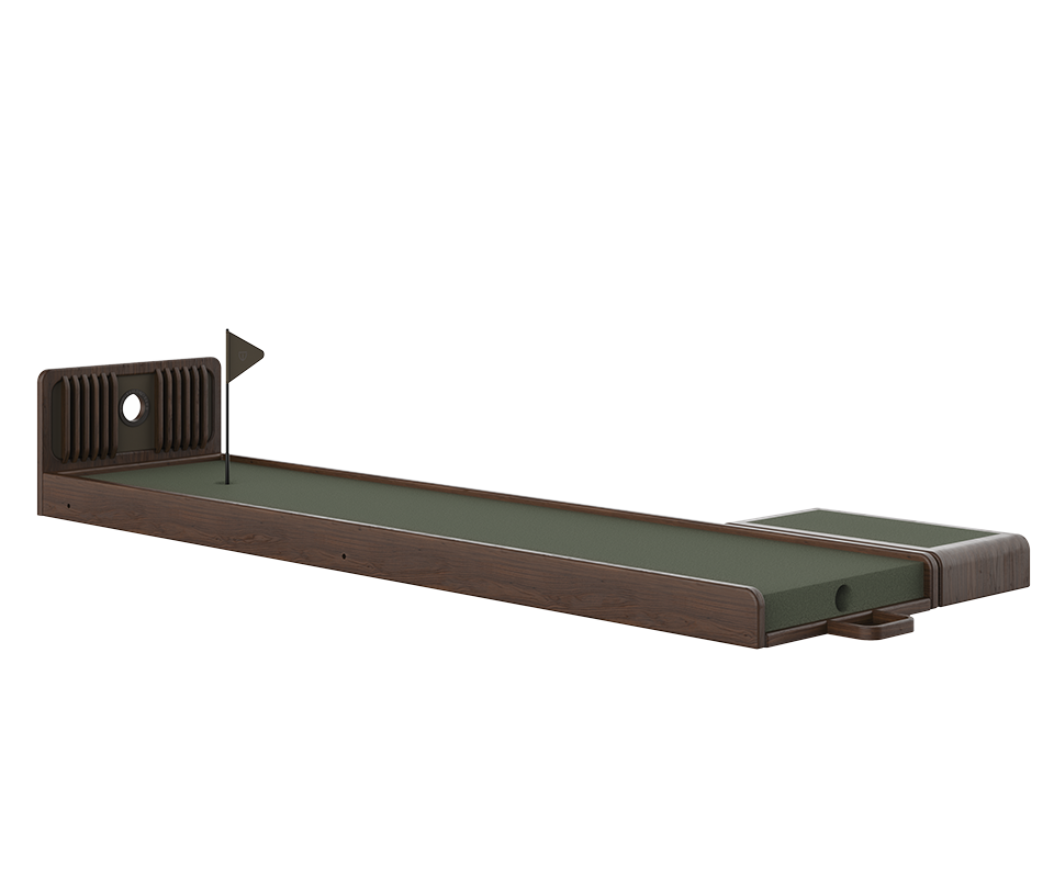 A side profile of the Sutherland Mini Golf set in Smoked Walnut wood. The long putting green features a dark green turf, a minimalist flag, and a decorative ribbed wooden headboard with a circular cutout.