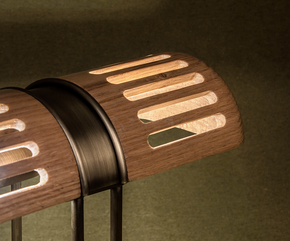 Turing Table Lamp Close-up of the Turing Table Lamp shade, highlighting the aged brass details and natural oak wood grain.