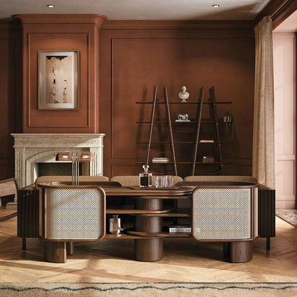 Living room interior showcasing the Wodehouse sideboard, structured in walnut wood with rattan details, placed next to the Blake shelf against a dark red wall.