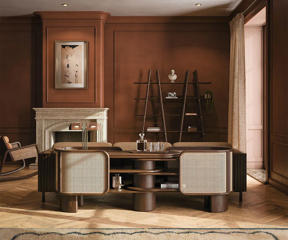 Wodehouse Sideboard Living room interior showcasing the Wodehouse sideboard, structured in walnut wood with rattan details, placed next to the Blake shelf against a dark red wall.